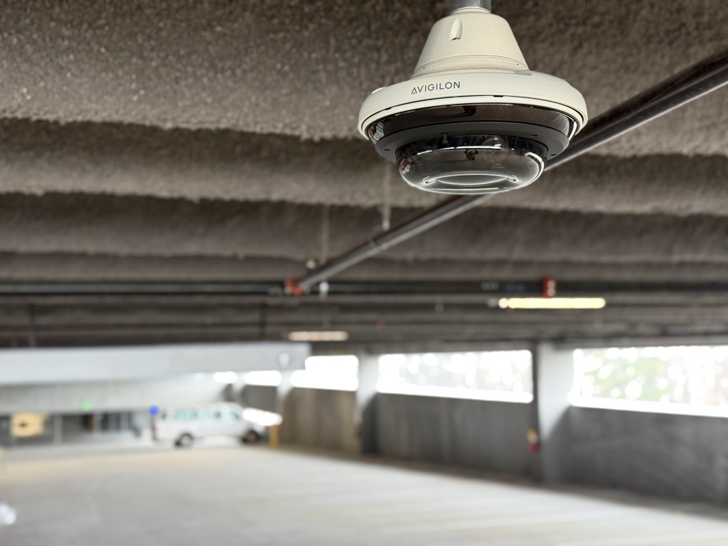 Security camera installed in a parking deck