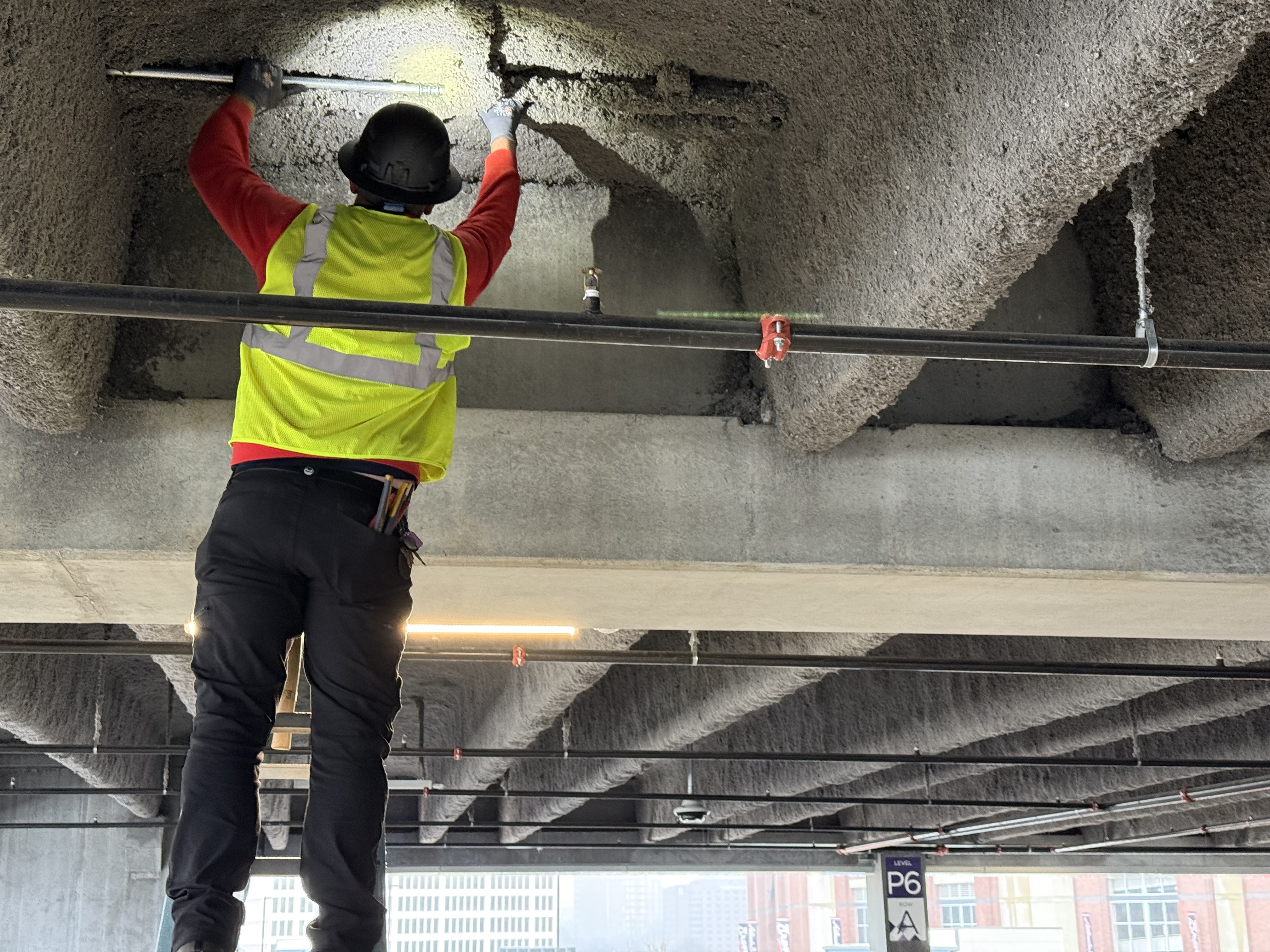 Astro Integrated Systems installing a security camera