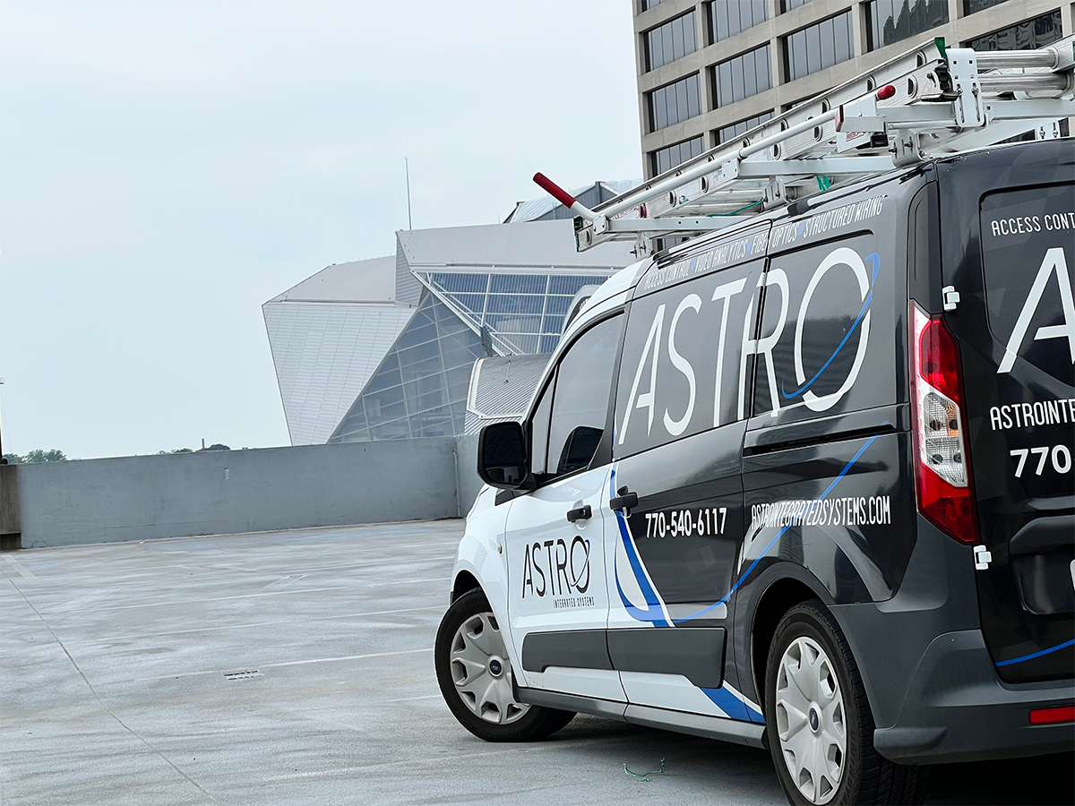 Astro Integrated Systems van overlooking a stadium in Atlanta, GA